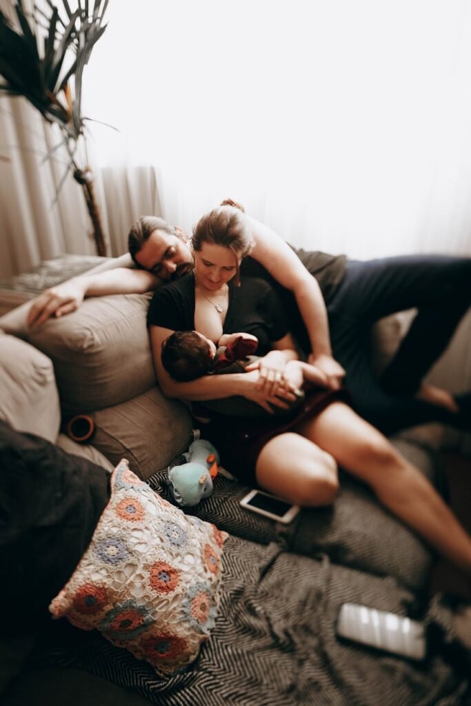 family with baby on couch
